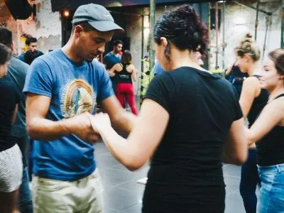 Students from Toucan Spanish learning to dance salsa at a club in Cali as part of their fun, social Spanish immersion activities.